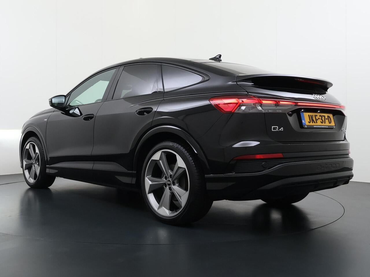 Audi Q4 Sportback e-tron 50 quattro 77 kWh S LINE VAN: ¤45.900,- VOOR: ¤40.877,- UW EINDEJAARSVOORDEEL: ¤5.023,- | in- exterieur | WARMTEPOMP| HEAD UP DISPLAY | ELECTR. STOELEN+GEHEUGEN | PANORAMADAK RIJKLAARPRIJS INCL. 12MND BOVAG | DEALER ONDERHOUDEN