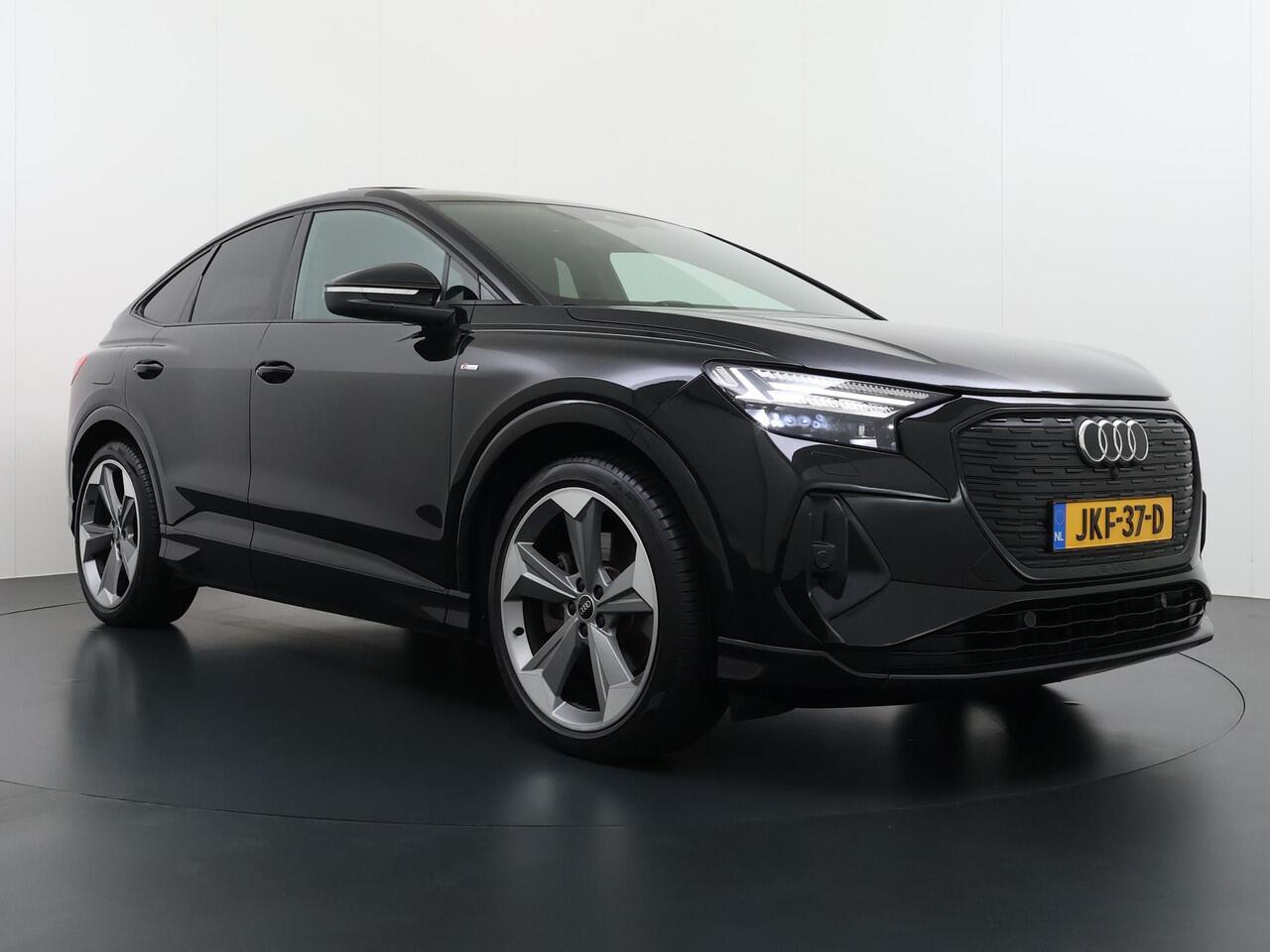 Audi Q4 Sportback e-tron 50 quattro 77 kWh S LINE VAN: ¤45.900,- VOOR: ¤40.877,- UW EINDEJAARSVOORDEEL: ¤5.023,- | in- exterieur | WARMTEPOMP| HEAD UP DISPLAY | ELECTR. STOELEN+GEHEUGEN | PANORAMADAK RIJKLAARPRIJS INCL. 12MND BOVAG | DEALER ONDERHOUDEN