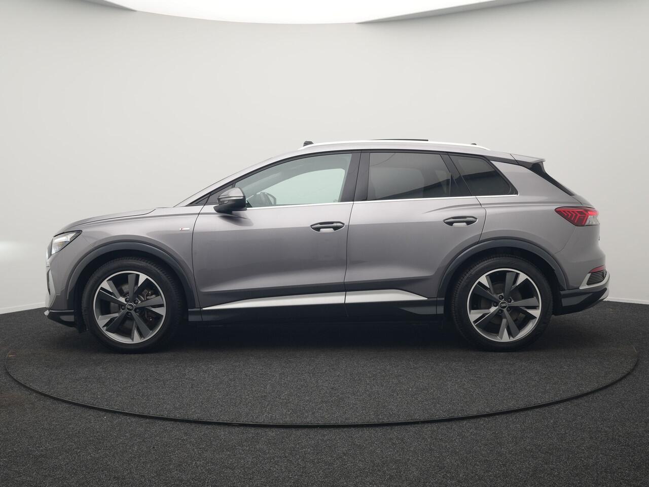 Audi Q4 e-tron 50 quattro S-Line 77 kWh 299pk Dealer O.H. Incl. BTW | Panodak | SOH 93,2% | Lederen Sportstoelen Verwarmd | 20"L.M | Navigatie | Cruise Control | Virtual | DAB | Taifungrau Metallic |