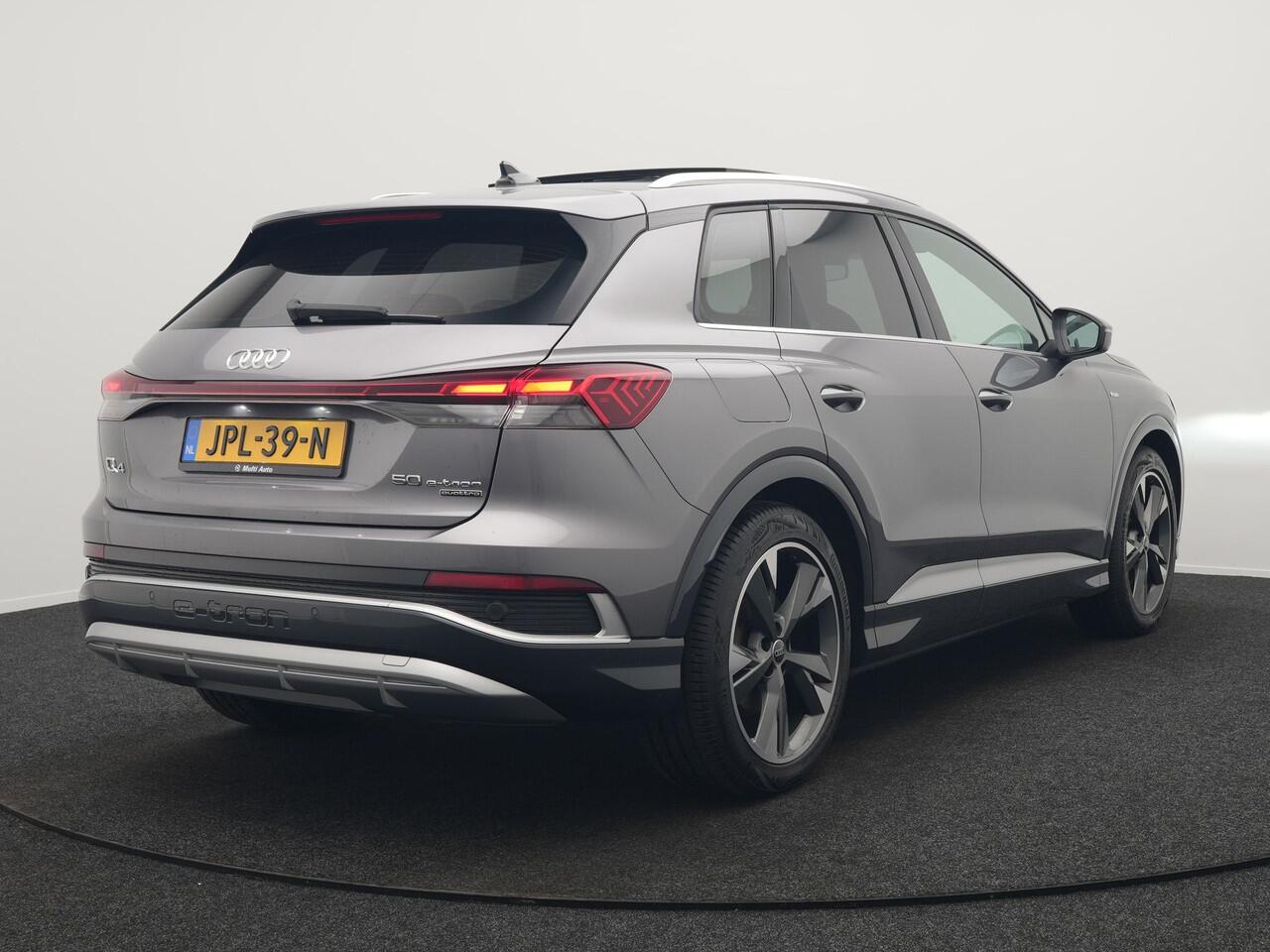 Audi Q4 e-tron 50 quattro S-Line 77 kWh 299pk Dealer O.H. Incl. BTW | Panodak | SOH 93,2% | Lederen Sportstoelen Verwarmd | 20"L.M | Navigatie | Cruise Control | Virtual | DAB | Taifungrau Metallic |