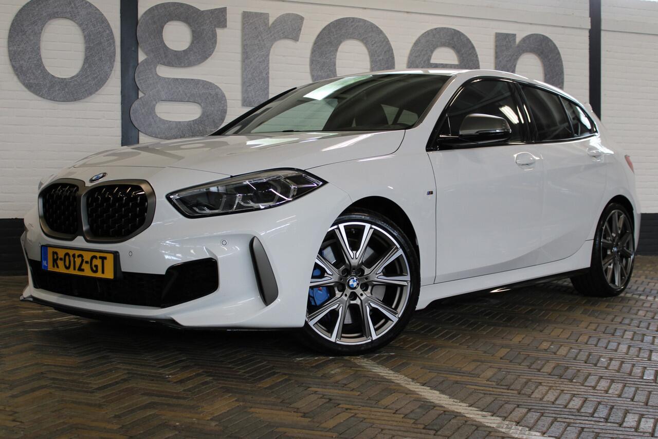 BMW 1-SERIE M135i xDrive High Executive | Akrapovic uitlaatsysteem | Cruise control | Climate control | Stoelverwarming | Apple carplay/Android auto | DAB radio | Dealer onderhouden |