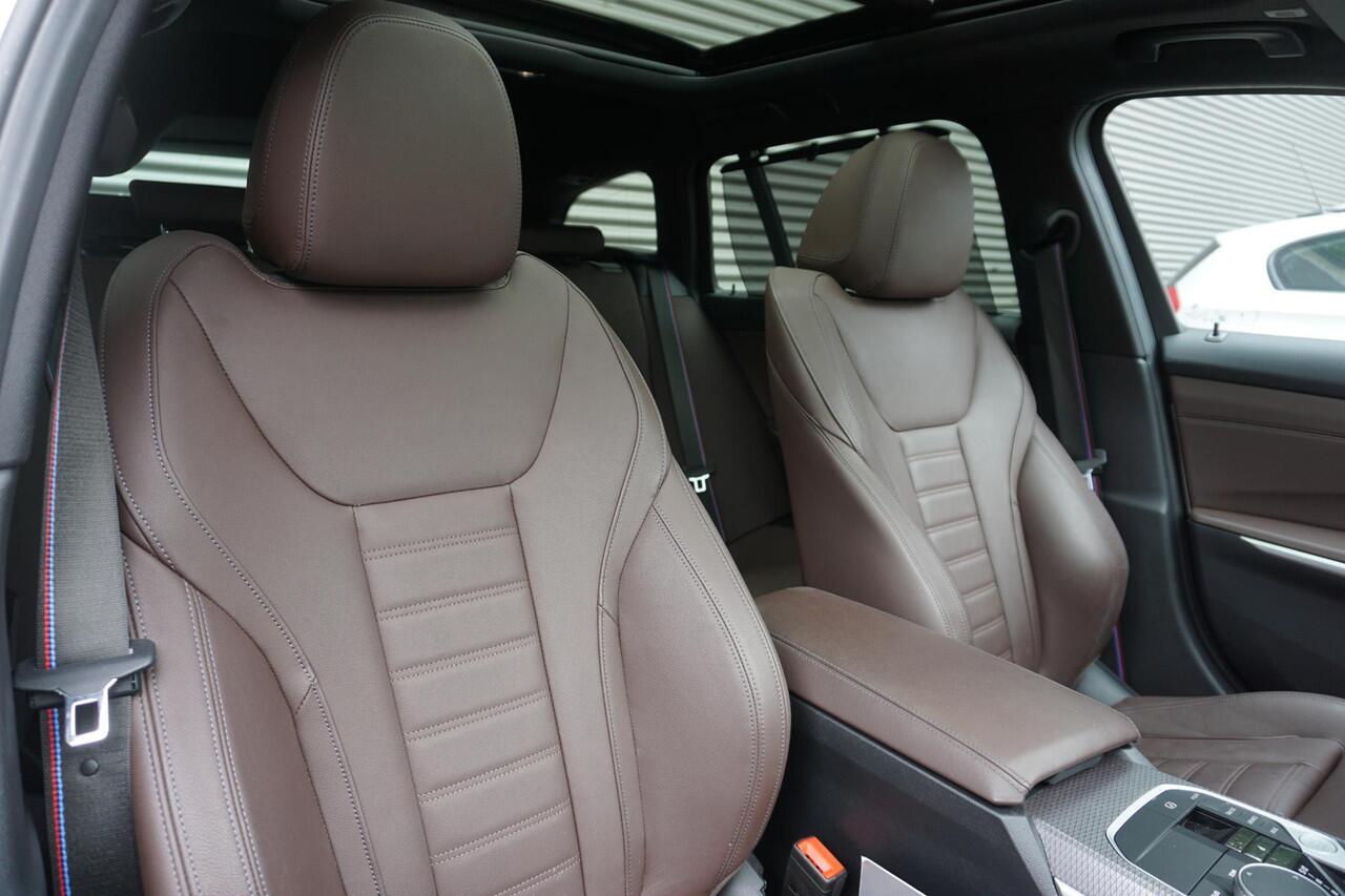 BMW 3-SERIE Touring 330i M Sportpakket Pro | Travel Pack | Glazen panoramadak | 19 inch LM Dubbelspaak | Extra getint glas | M Sportremsysteem Rot