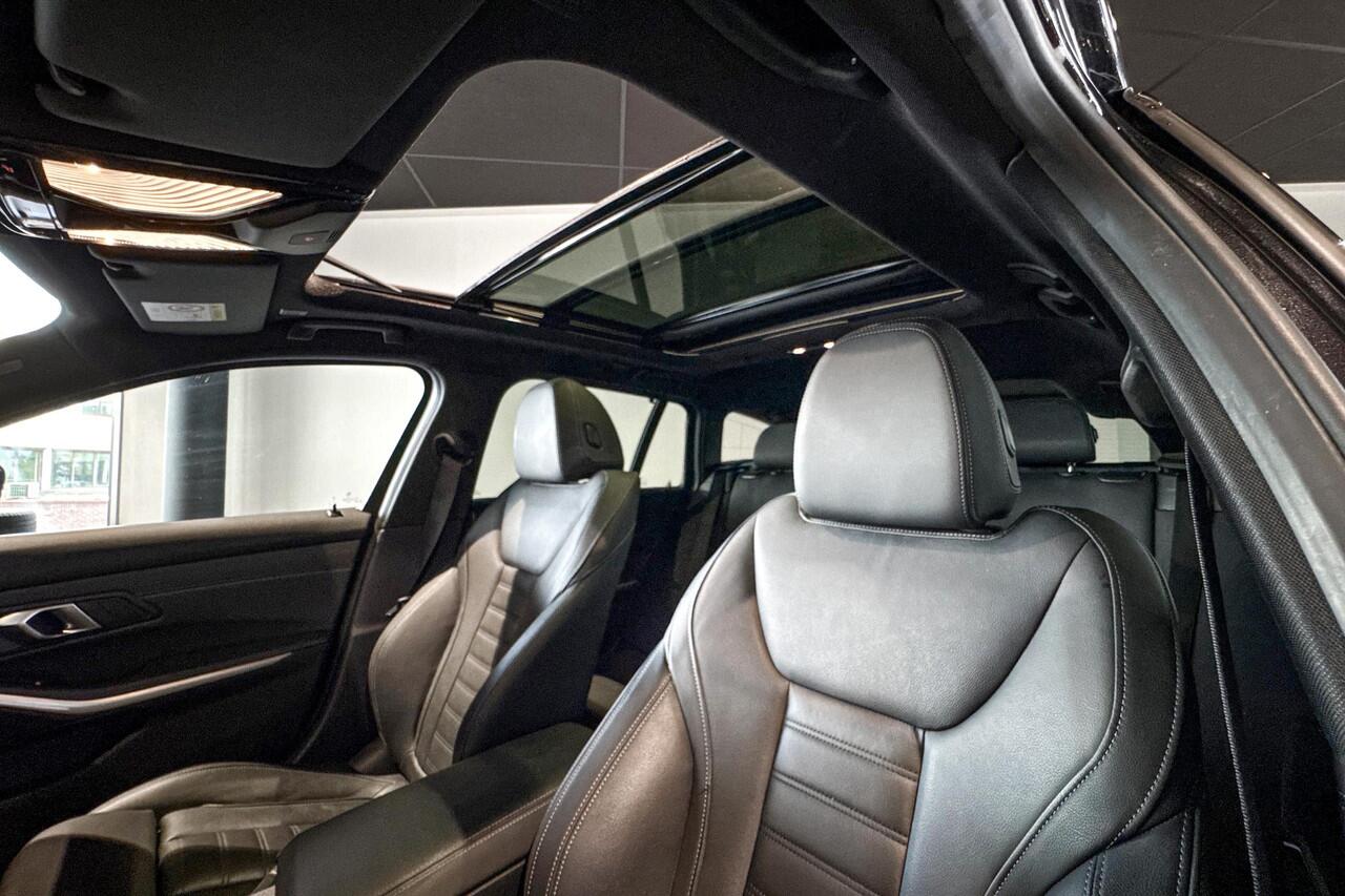 BMW 3-SERIE Touring 320e | M Sport | Glazen Panoramadak | Stoelverwarming | Comfort Access | HIFI |