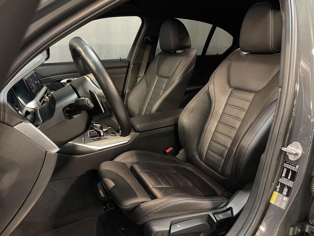 BMW 3-SERIE 320e High Executive 18"/Leder/Laser LED/Stuur + stoelverwarming/Dodehoek/Elektrische klep/Trekhaak/Hed-up/Keyless