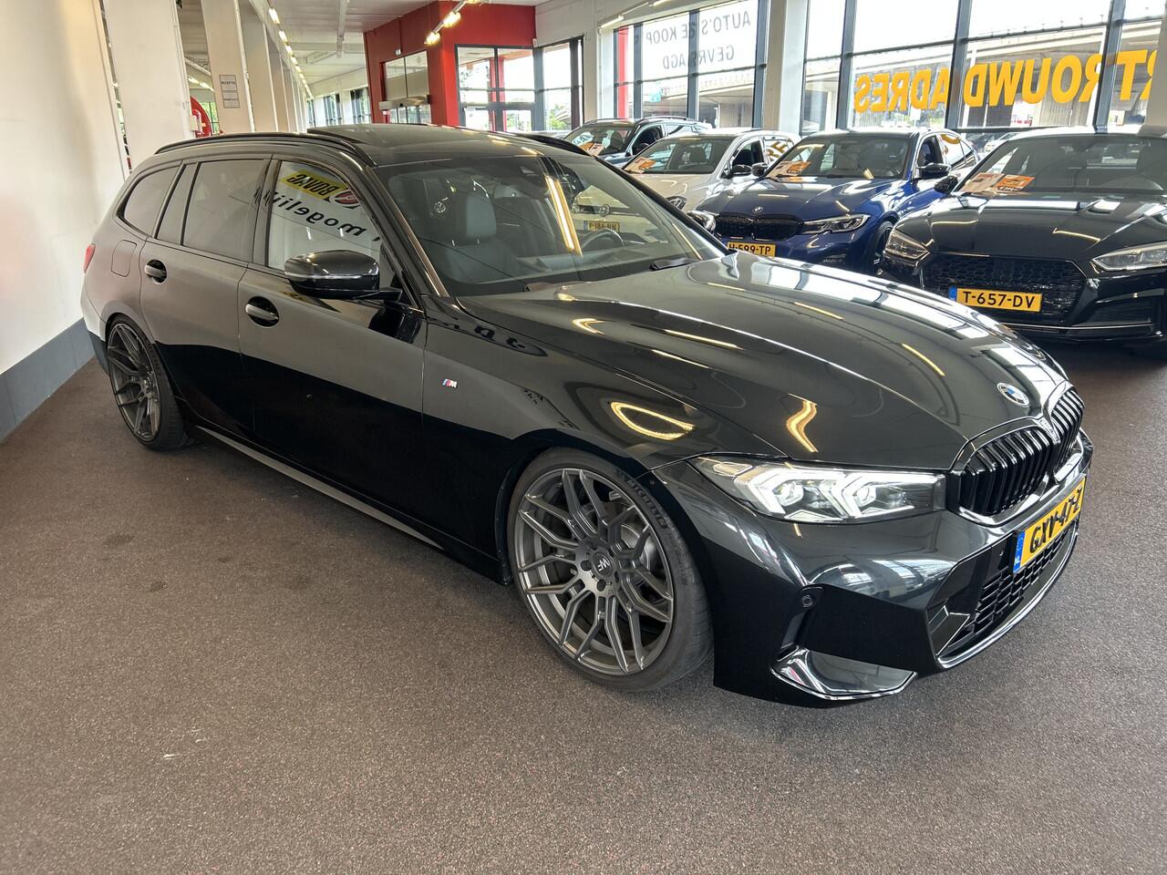 BMW 3-SERIE Touring 318i M Sport | Panoramadak | Fabrieksgarantie | 20''INCH | Verlaagd | Lederen bekleding | Afneembare trekhaak | Cruise control | Climate control | Lane assist | Apple carplay | Full LED