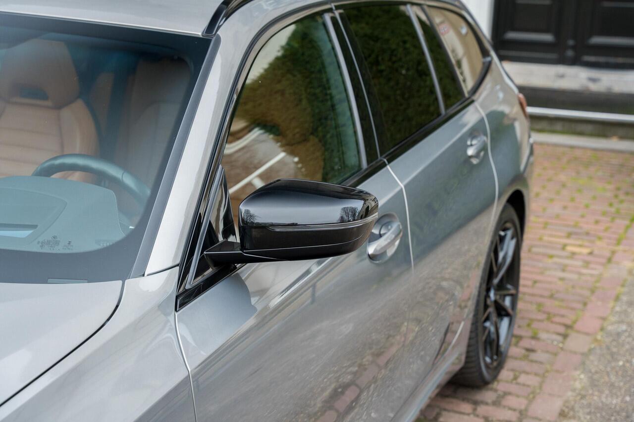 BMW 3-SERIE Touring 330e High Executive TREKHAAK | PANO | KUIPSTOELEN | LASER | ACC | H&K