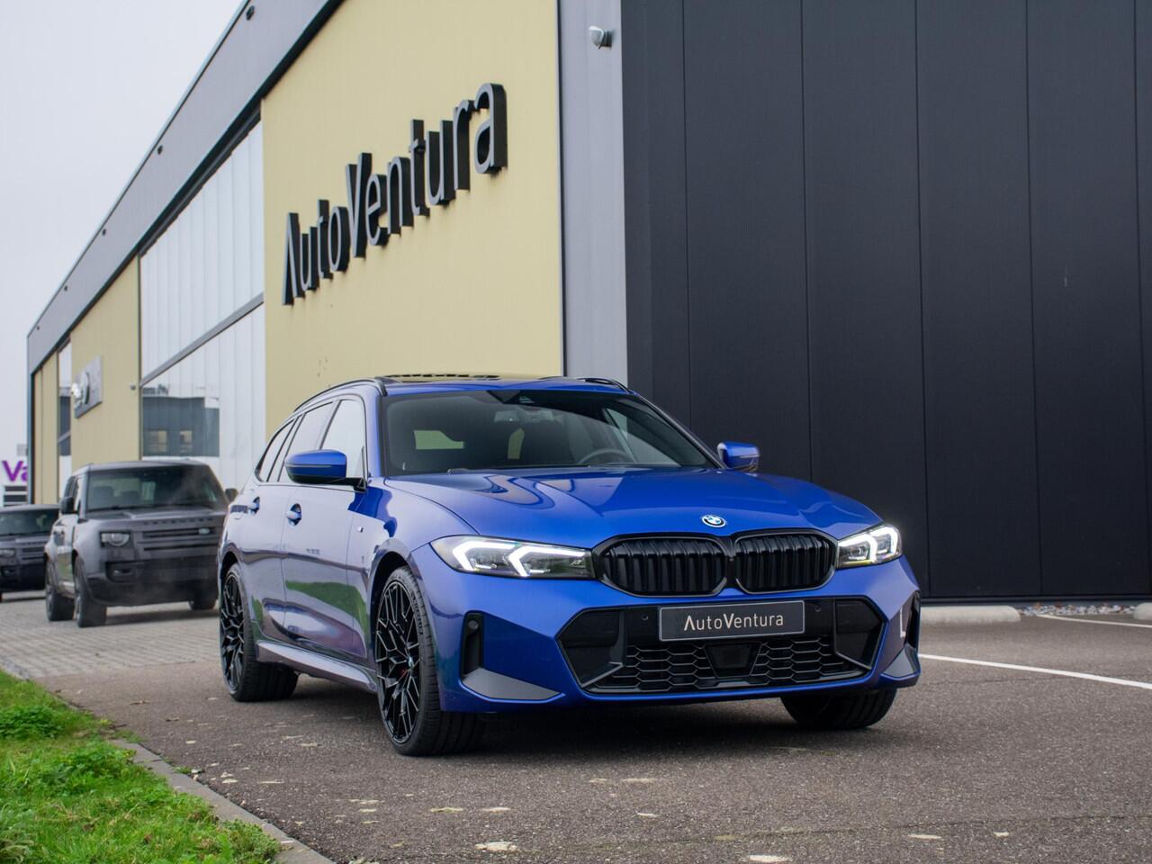 BMW 3-SERIE Touring 330e l Long Range l Trekhaak l M-sport l Schuif-/kantel dak l Adaptive LED l Verwarmd Stuurwiel l Head-Up l 20"