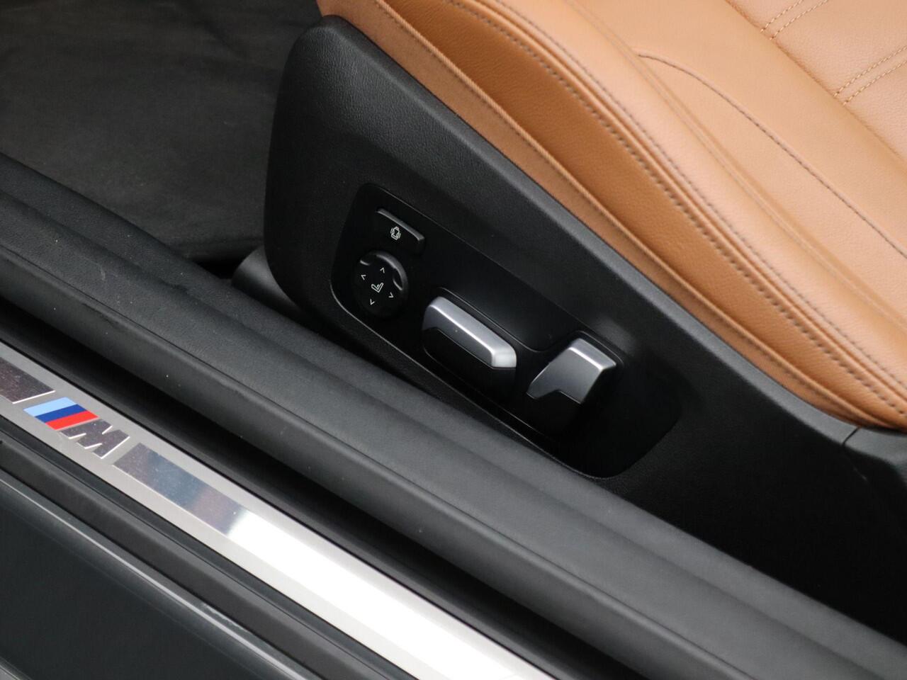 BMW 4-SERIE Cabrio M440i xDrive High Executive | Stuurwielrand Verwarmd | Trekhaak | Windscherm | Driving Assistant Professional | Parking Assistant Plus | Head-Up Display | Harman Kardon | 19''