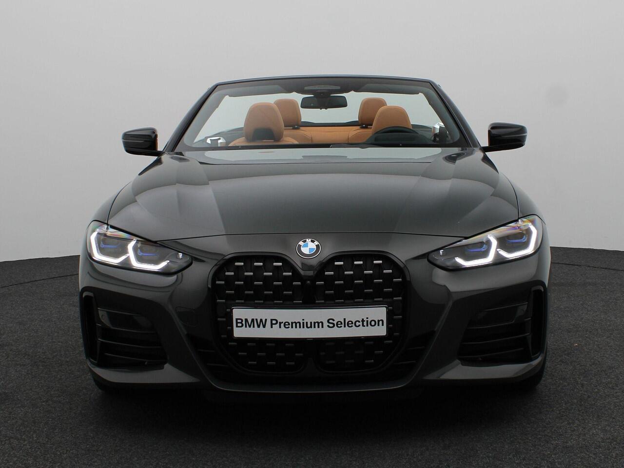 BMW 4-SERIE Cabrio M440i xDrive High Executive | Stuurwielrand Verwarmd | Trekhaak | Windscherm | Driving Assistant Professional | Parking Assistant Plus | Head-Up Display | Harman Kardon | 19''