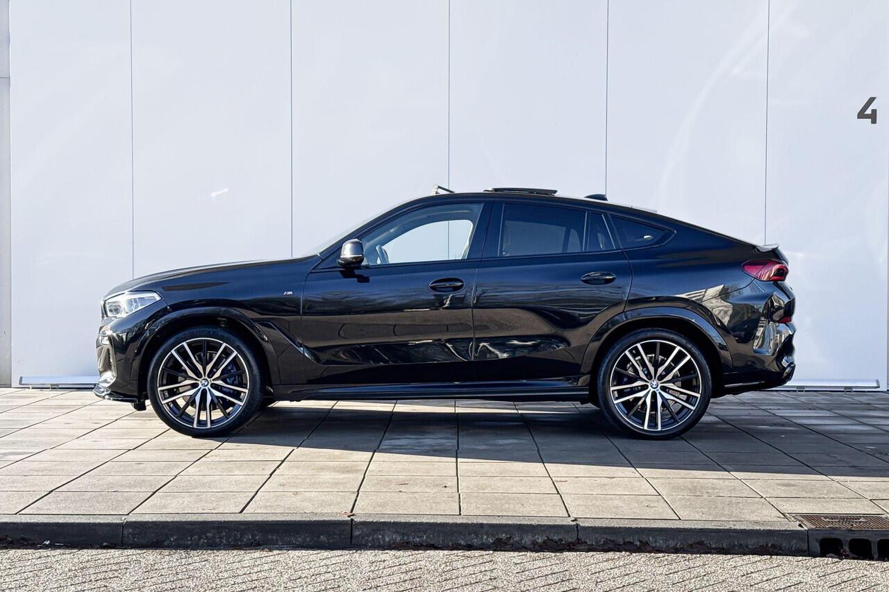BMW X6 M50i High Executive M-Sport 22 Inch / Adaptief M-Onderstel / Soft Close / Glazen Schuifdak / Stoel ventilatie / Stoelverwarming Voor & Achter/ Warmte Comfort Pakket / Driving Assistant / Parking Assistant Plus / laser Ligt / Harman Kardon / Head Up Displa