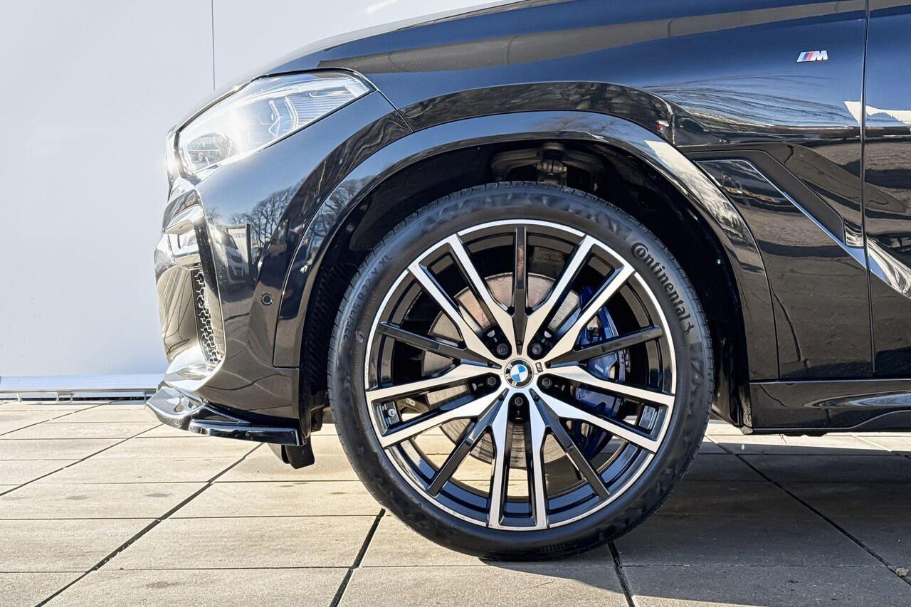 BMW X6 M50i High Executive M-Sport 22 Inch / Adaptief M-Onderstel / Soft Close / Glazen Schuifdak / Stoel ventilatie / Stoelverwarming Voor & Achter/ Warmte Comfort Pakket / Driving Assistant / Parking Assistant Plus / laser Ligt / Harman Kardon / Head Up Displa
