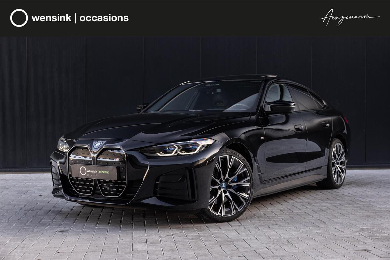 BMW i4 M50 High Executive 84 kWh | SOH 98% | M-Sport | Schuif/Kantel dak | Sportstoelen | Harman/Kardon | x-Drive | Widescreen | Adaptief Onderstel | DAB | Stoelen/stuur verwarmbaar | Trekhaak | Laserlicht |