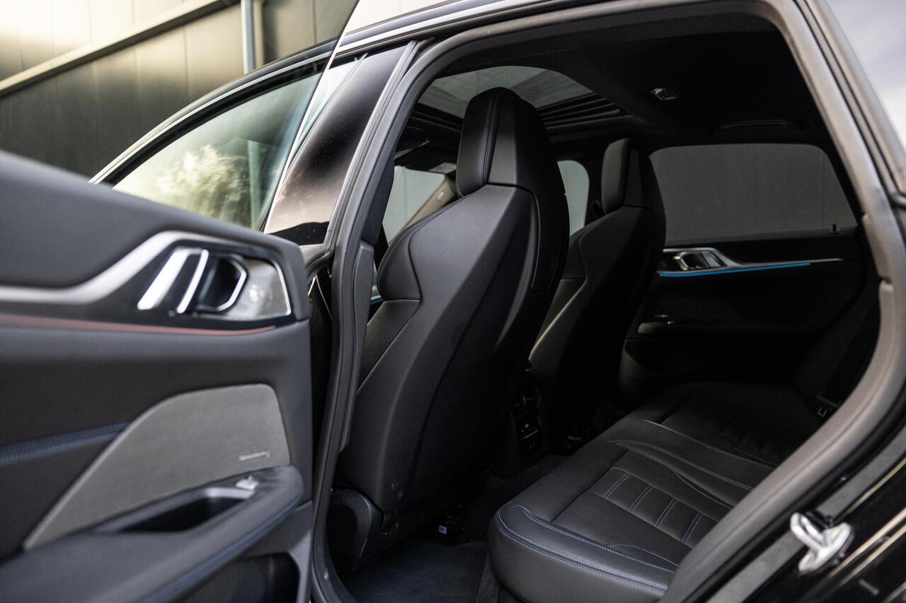 BMW i4 M50 High Executive 84 kWh | SOH 98% | M-Sport | Schuif/Kantel dak | Sportstoelen | Harman/Kardon | x-Drive | Widescreen | Adaptief Onderstel | DAB | Stoelen/stuur verwarmbaar | Trekhaak | Laserlicht |