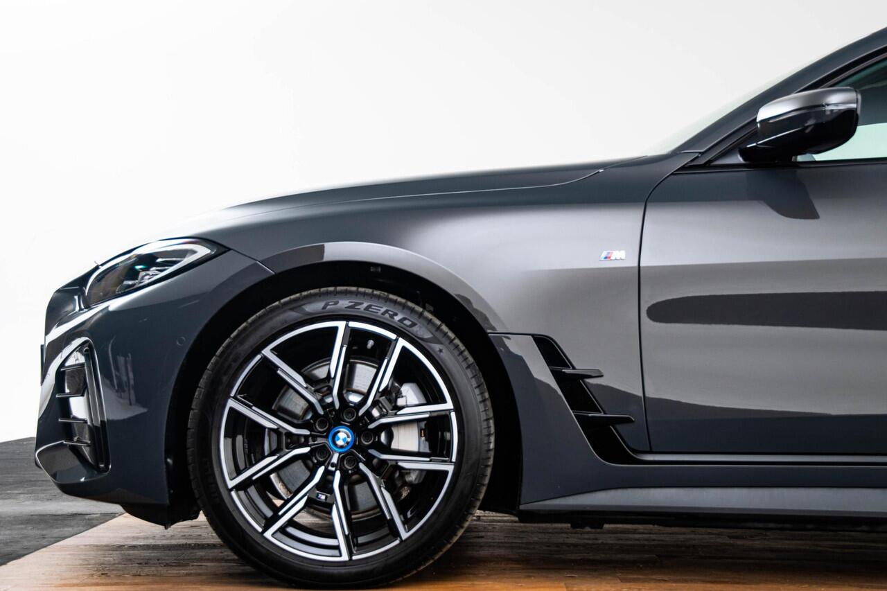 BMW i4 eDrive40 84 kWh M Sport - Trekhaak - Elektrisch verwarmde voorstoelen - Active Cruise Control - Getinte Ruiten - Comfort Access - Hifi - Ambiance verlichting - Live Cockpit Professional - IconicSounds Electric -