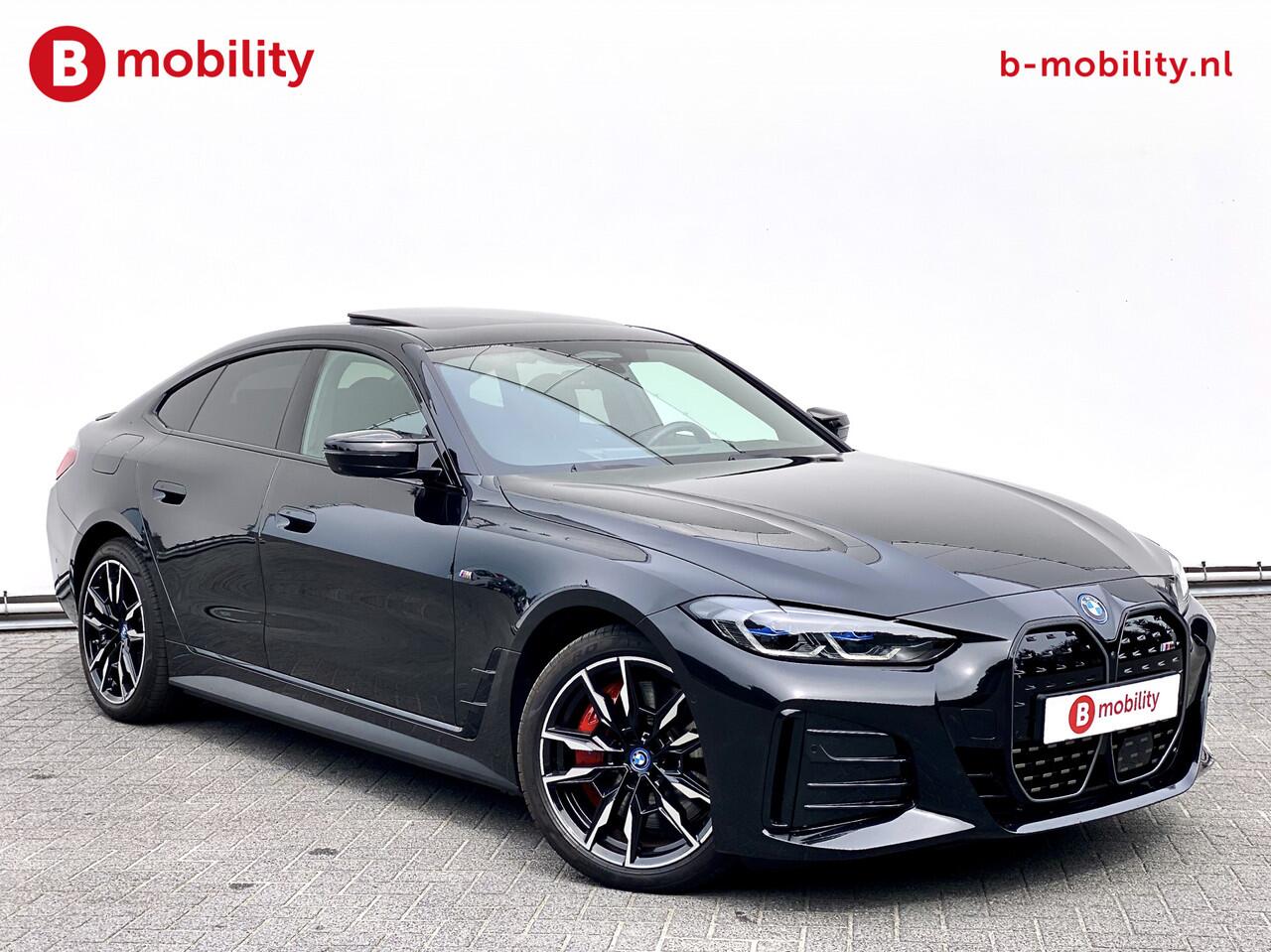 BMW i4 M50 544Pk High Executive 84 kWh Elektrisch verstelbare stoelen | Trekhaak 1600kg | Schuif/Kanteldak | Driving Assistant Professional | Harman Kardon Sound System | Head Up Display | Verwarmbaar stuurwiel | Interieurlijsten Carbon Fibre | Parking Assist.