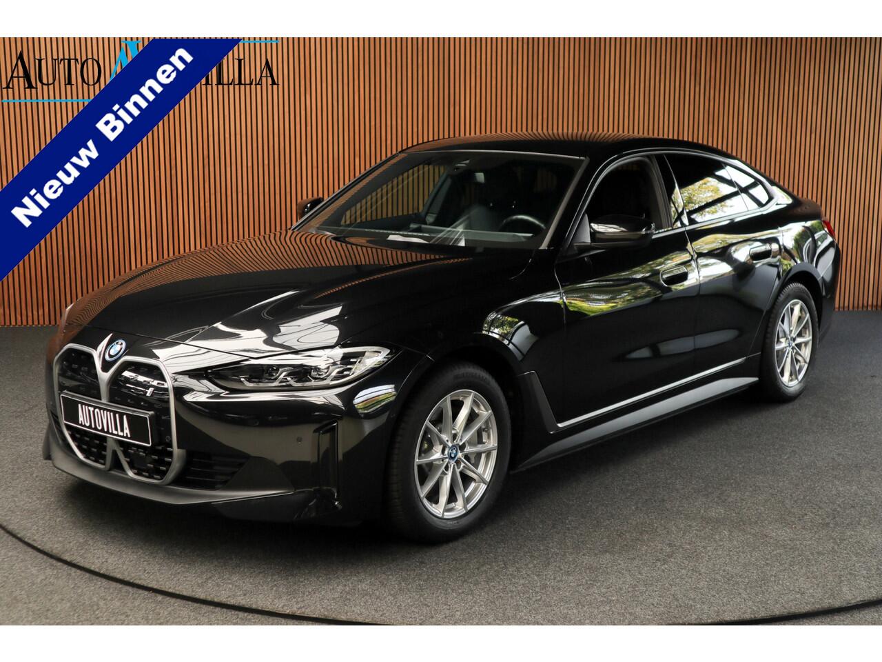 BMW i4 eDrive40 84 kWh M-pakket Navi Leer Elektr. achterklep 360° Camera Co-pilot Climate voor & achter Zwarte hemelbekleding PDC LM velgen BTW auto