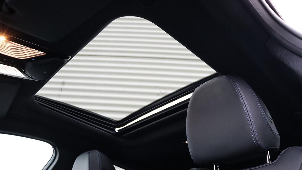 BMW i4 eDrive35 High Executive M-Sport | Harman/Kardon | Schuifdak | Head-up | Trekhaak | Driving Assistant Professional