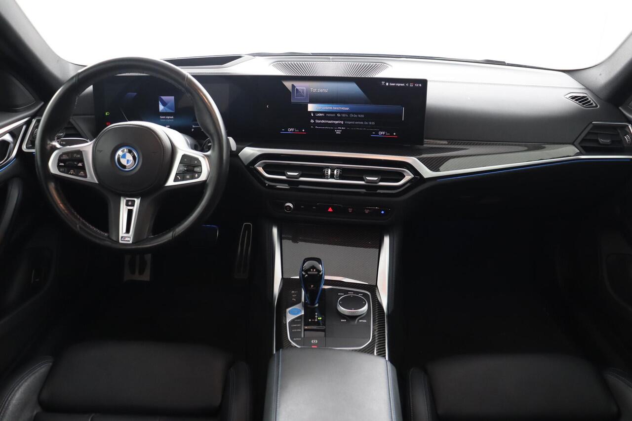 BMW i4 M50 High Executive 84 kWh | Schuif-/kanteldak | Adaptief M Onderstel | Comfort Access | Driving Assistant Professional | Stuur- en stoelverwarming | Laserlight | Carbon Interieur |
