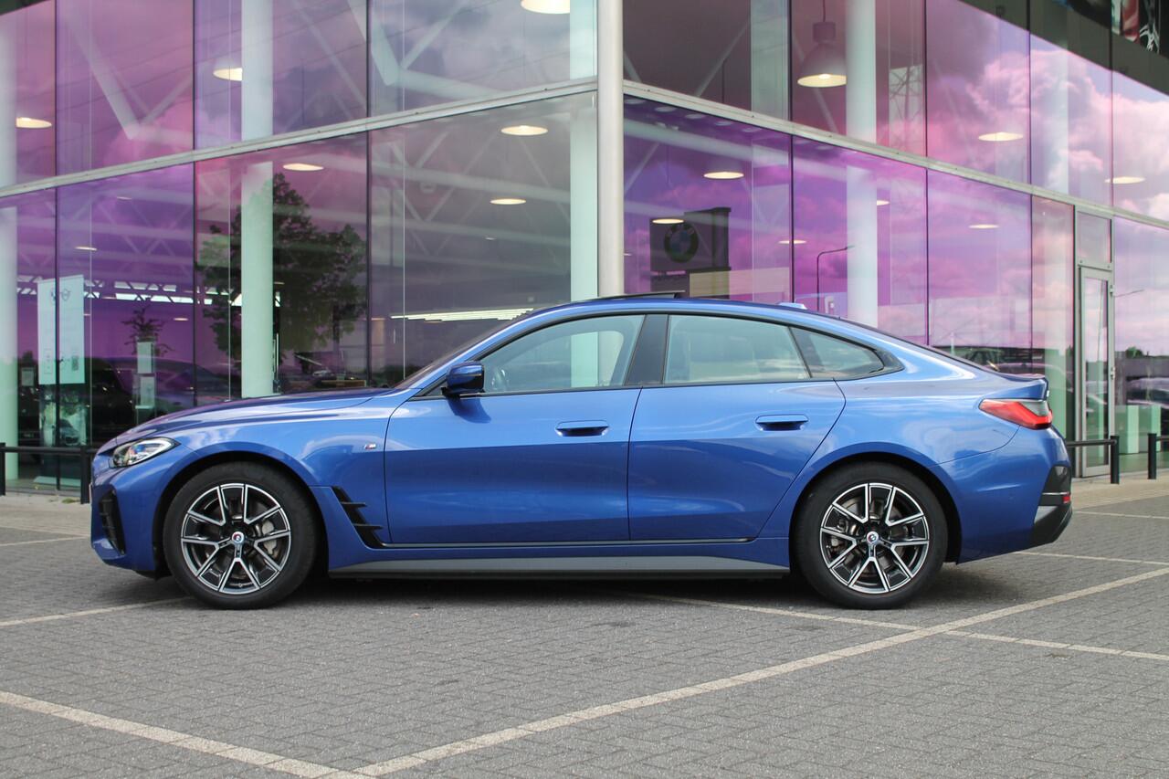 BMW i4 eDrive40 M-Sport / Schuif-kanteldak / Achteruitrijcamera / Live Cockpit Plus / Parking Assistant / Stoelverwarming