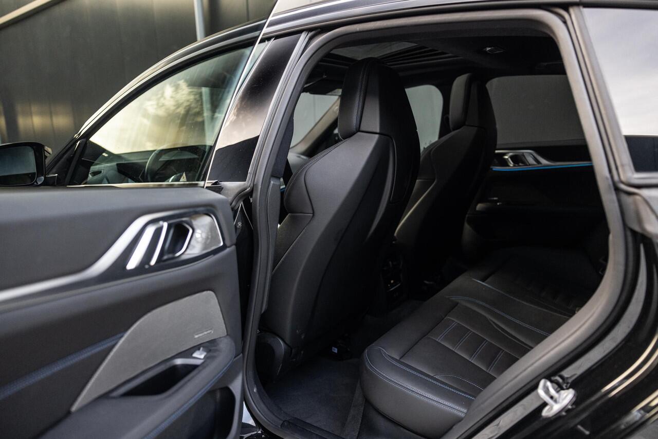 BMW i4 M50 High Executive 84 kWh | SOH 98% | M-Sport | Schuif/Kantel dak | Sportstoelen | Harman/Kardon | x-Drive | Widescreen | Adaptief Onderstel | DAB | Stoelen/stuur verwarmbaar | Trekhaak | Laserlicht |