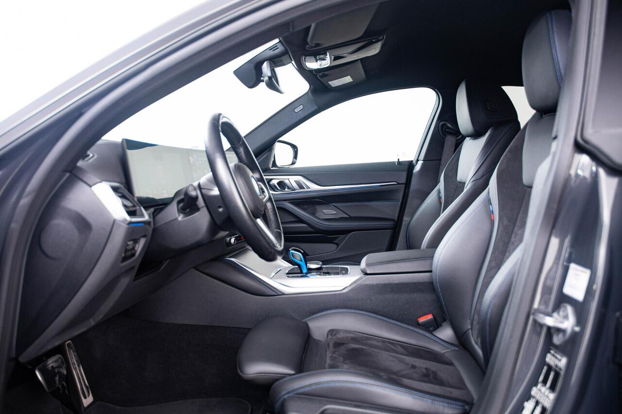 BMW i4 eDrive40 84 kWh M Sport - Trekhaak - Elektrisch verwarmde voorstoelen - Active Cruise Control - Getinte Ruiten - Comfort Access - Hifi - Ambiance verlichting - Live Cockpit Professional - IconicSounds Electric -