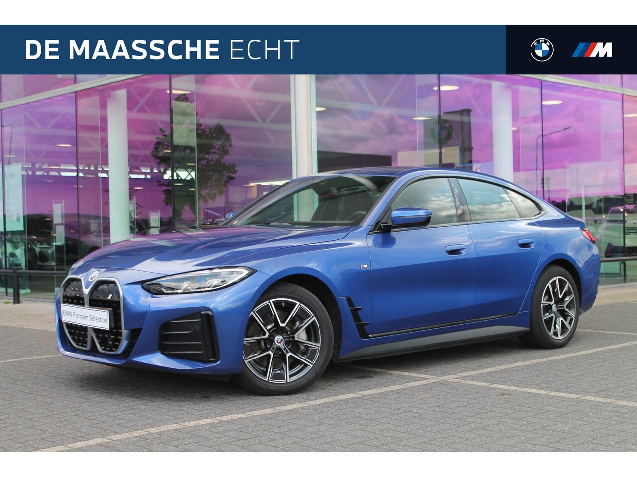 BMW i4 eDrive40 M-Sport / Schuif-kanteldak / Achteruitrijcamera / Live Cockpit Plus / Parking Assistant / Stoelverwarming