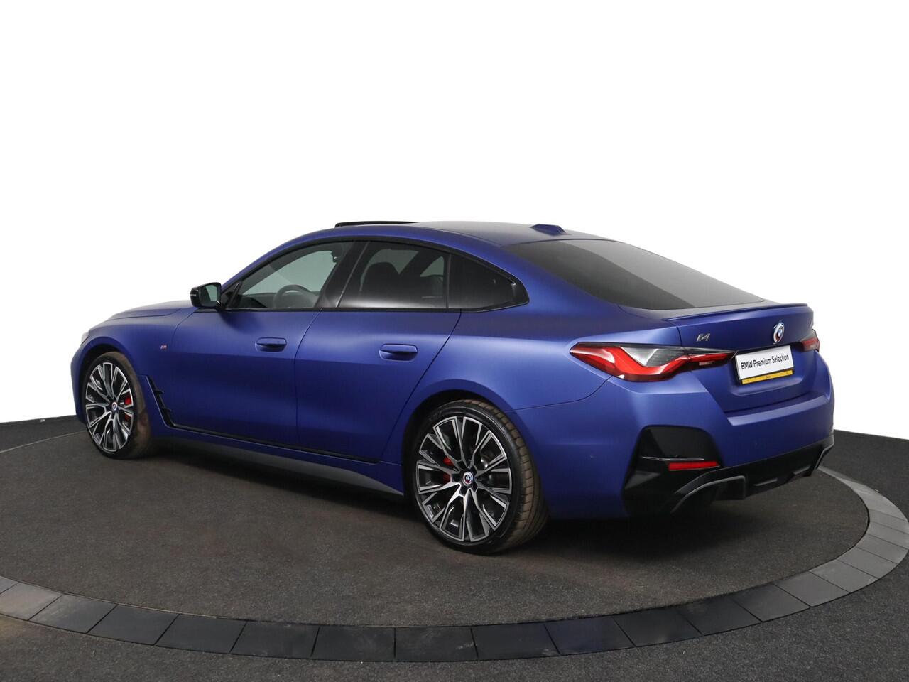 BMW i4 M50 High Executive 84 kWh | Schuif-/kanteldak | Adaptief M Onderstel | Comfort Access | Driving Assistant Professional | Stuur- en stoelverwarming | Laserlight | Carbon Interieur |