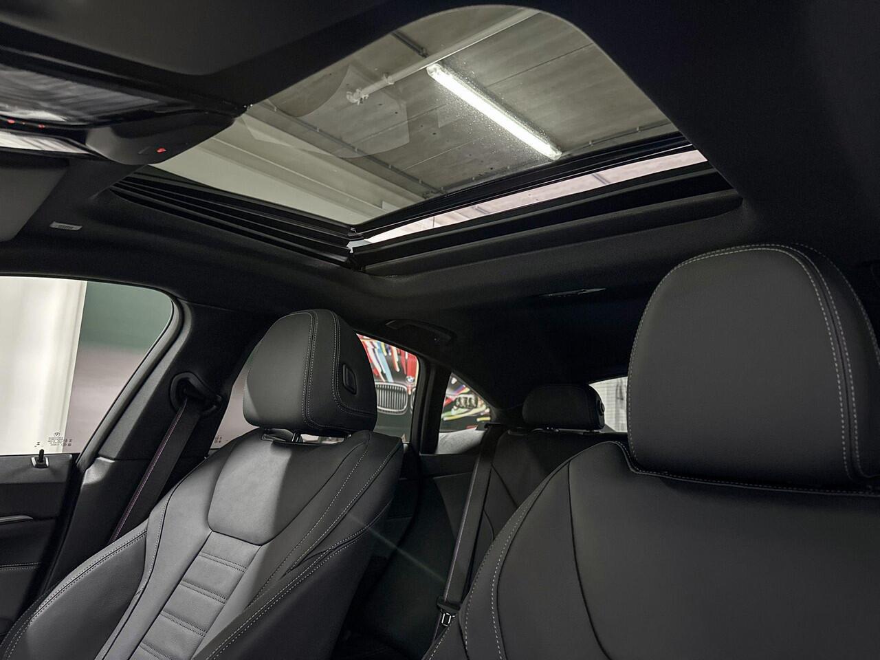 BMW i4 eDrive35 | M-Sport Pro | High Executive | Active Cruise Control | Schuif-/kanteldak | Selections