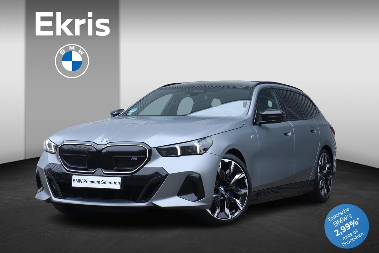 BMW i5 Touring M60 xDrive | M Sportpakket Pro | Trekhaak | Panodak | Driving Assistant Prof. | Parking Assistant Prof. | Bowers & Wilkins Surround Sound | Stoelventilatie | Comfort Pack | Glasapplicatie | Iconic Glow | 21''LMV