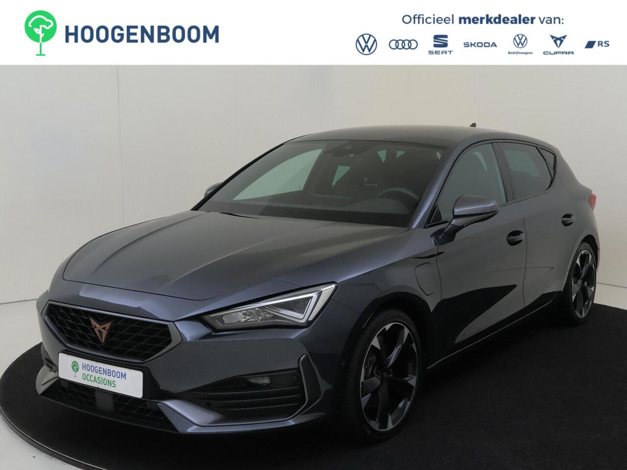 Cupra Leon 1.4 e-Hybrid Business | Parkeerassistent | Adaptieve demping systeem | 3-zone airco | Keyless | Dodehoek detectie | Achteruitrijcamera | Stoel- en stuurwielverwarming | CarPlay |