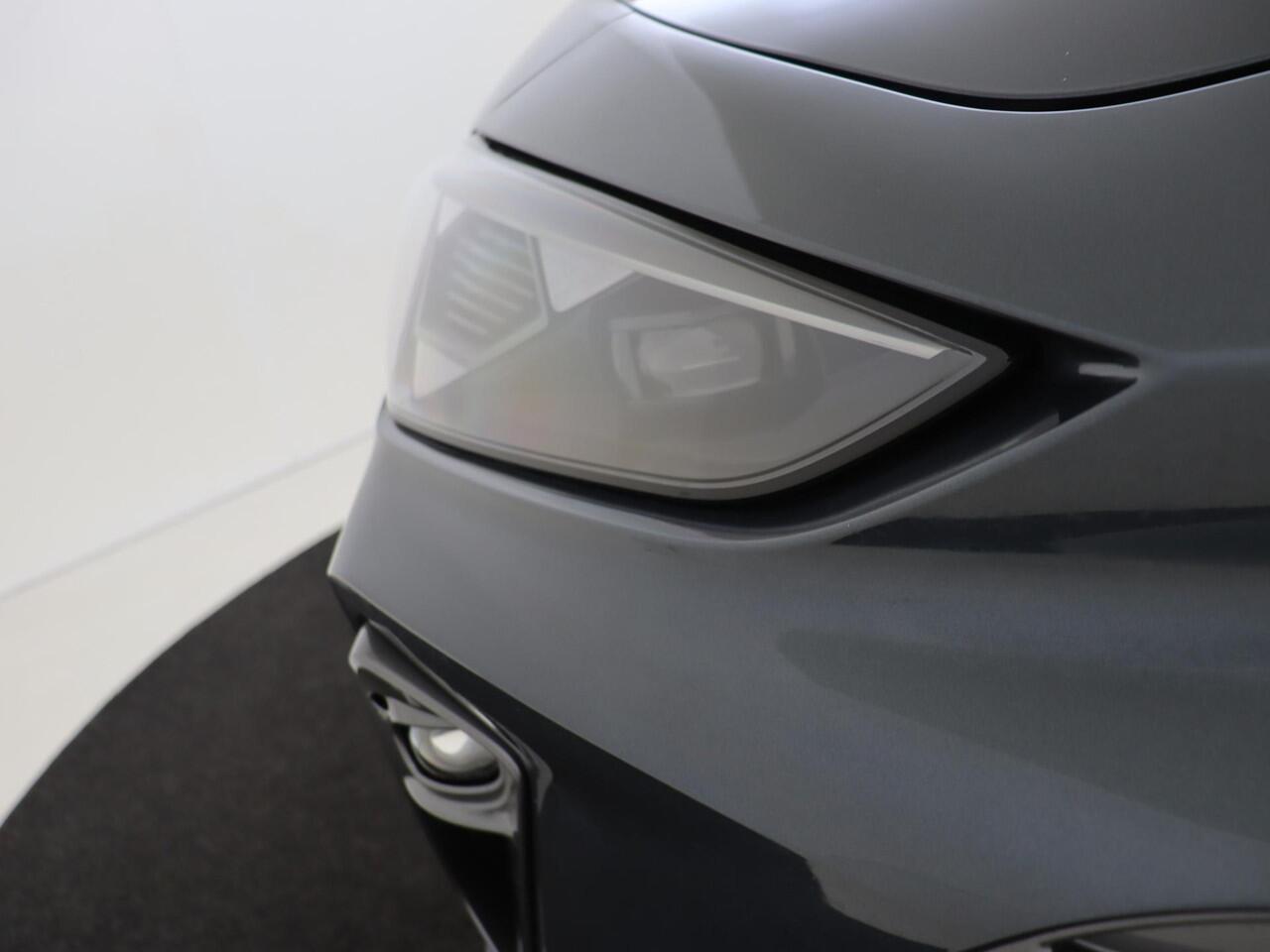 Cupra Leon Sportstourer 1.5 TSI e-Hybrid Business | SoH 100% | Trekhaak | Kuipstoelen | Dodehoek detectie | Parkeerassistent | Keyless | Stoel- en stuurwielverwarming | Adaptieve cruise control | Achteruitrijcamera |