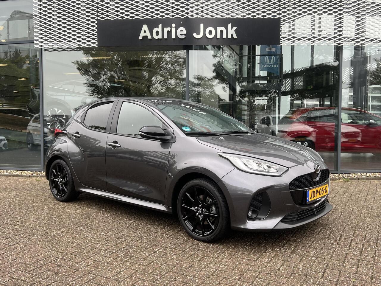 Mazda 2 Hybrid 1.5 Homura Plus AUTOMAAT | STOEL- EN STUURVERWARMING | PARKEERSENSOREN V+A | ACHTERUITRIJCAMERA | DODEHOEKDETECTIE | NAVIGATIE | CARPLAY | DRAADLOZE TELEFOONLADER | DIGITAAL DASHBOARD | KEYLESS |