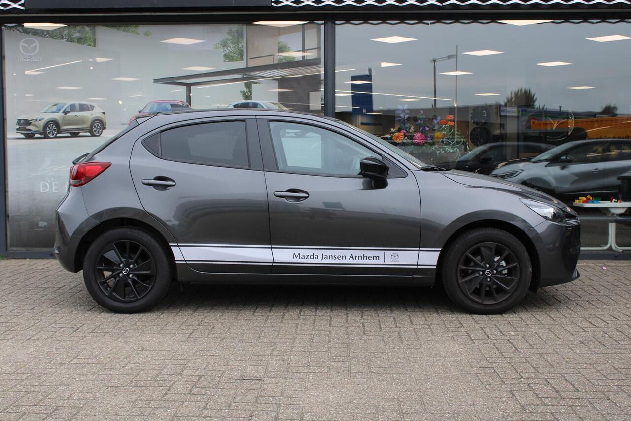 Mazda 2 1.5 e-SkyActiv-G 90 Homura , Demovoordeel ¤3.340 -, Apple Carplay, LMV 16 Inch, Camera, PDC, Clima, Cruise, Stuur/Stoelverwarming, BSM, LKA