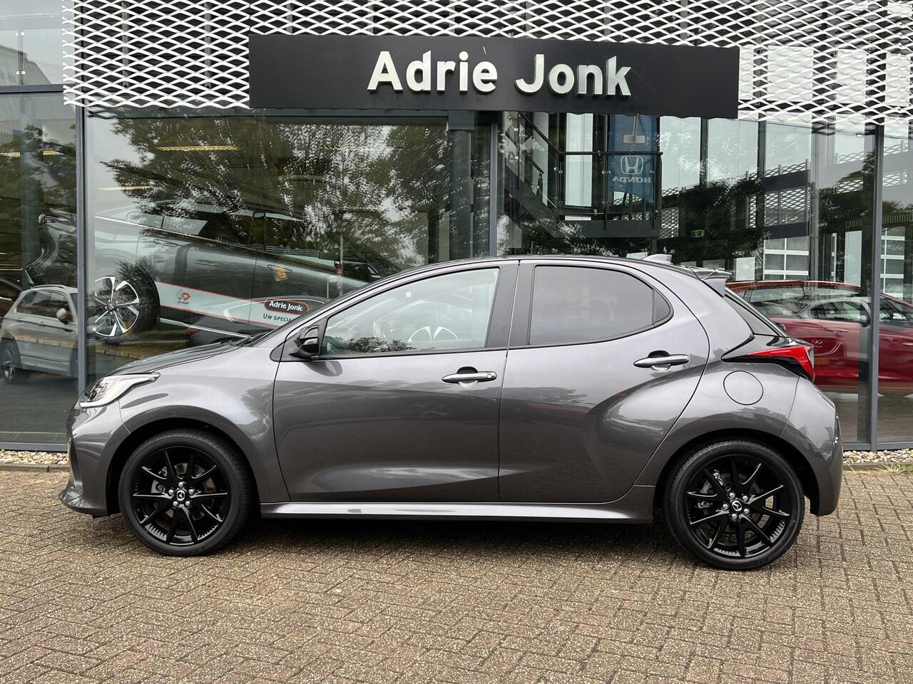 Mazda 2 Hybrid 1.5 Homura Plus AUTOMAAT | STOEL- EN STUURVERWARMING | PARKEERSENSOREN V+A | ACHTERUITRIJCAMERA | DODEHOEKDETECTIE | NAVIGATIE | CARPLAY | DRAADLOZE TELEFOONLADER | DIGITAAL DASHBOARD | KEYLESS |