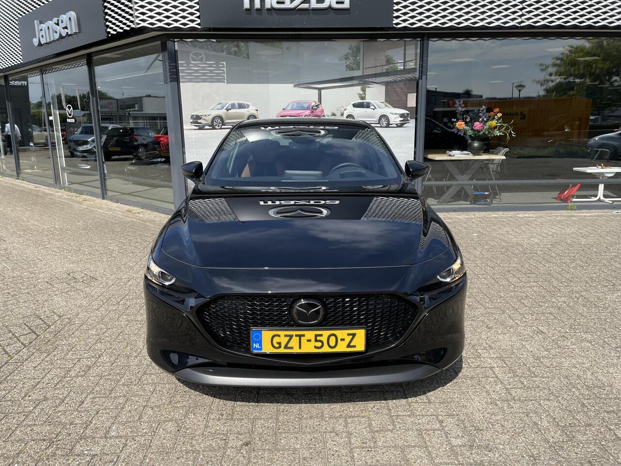 Mazda 3 HB 2.0 e-SkyActiv-X 186 M Hybrid Nagisa , Demovoordeel ¤6.985,-, Jansen Performance uitvoering, Bruin Leder, Bose, Navi, Adap.Cruise, Clima, Apple Carplay, Camera, PDC, HUD, Stoelverwarming, 18" LMV