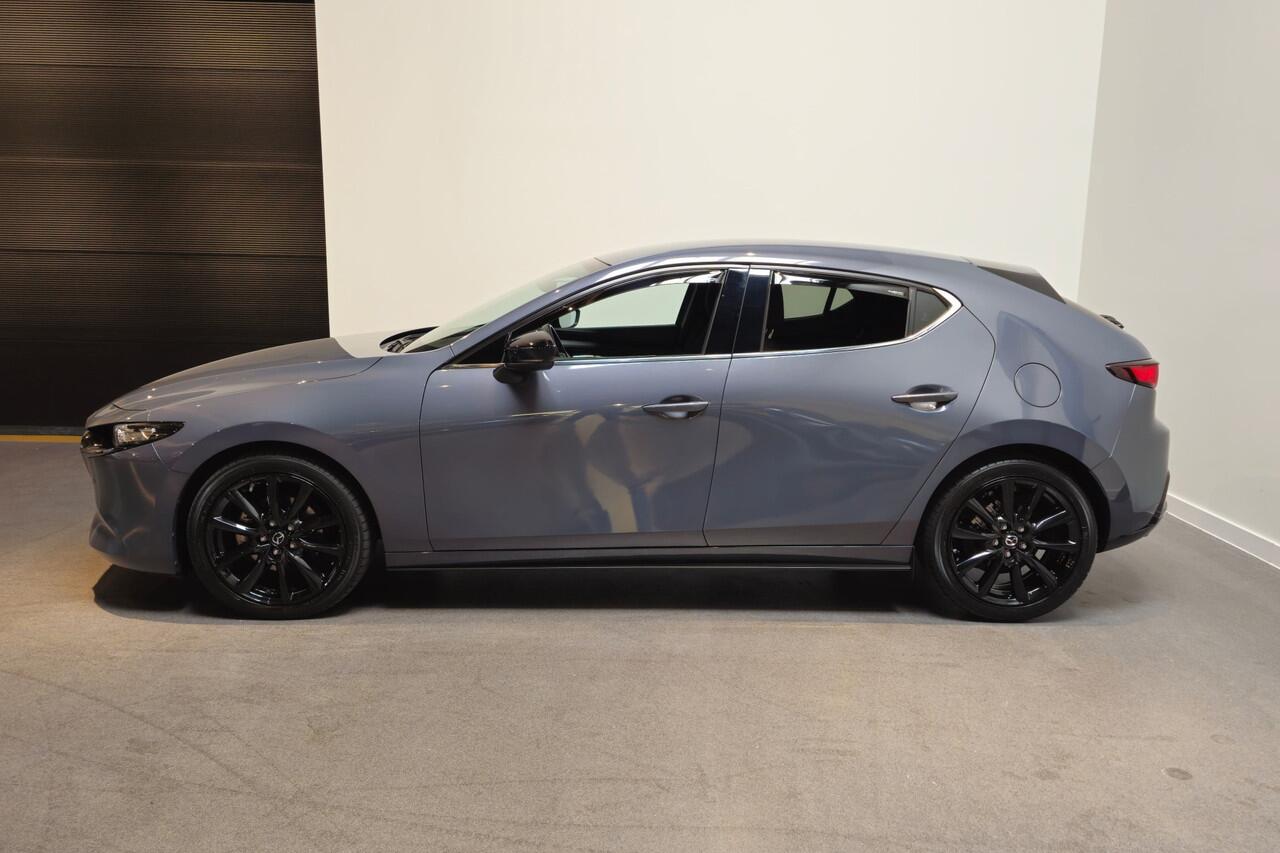 Mazda 3 2.0 e-SkyActiv-G M Hybrid 150 Homura - Stoelverwarming - Apple Carplay/ Android Auto - Adaptive Cruise - Bose audio - Headup display - Afneembare trekhaak