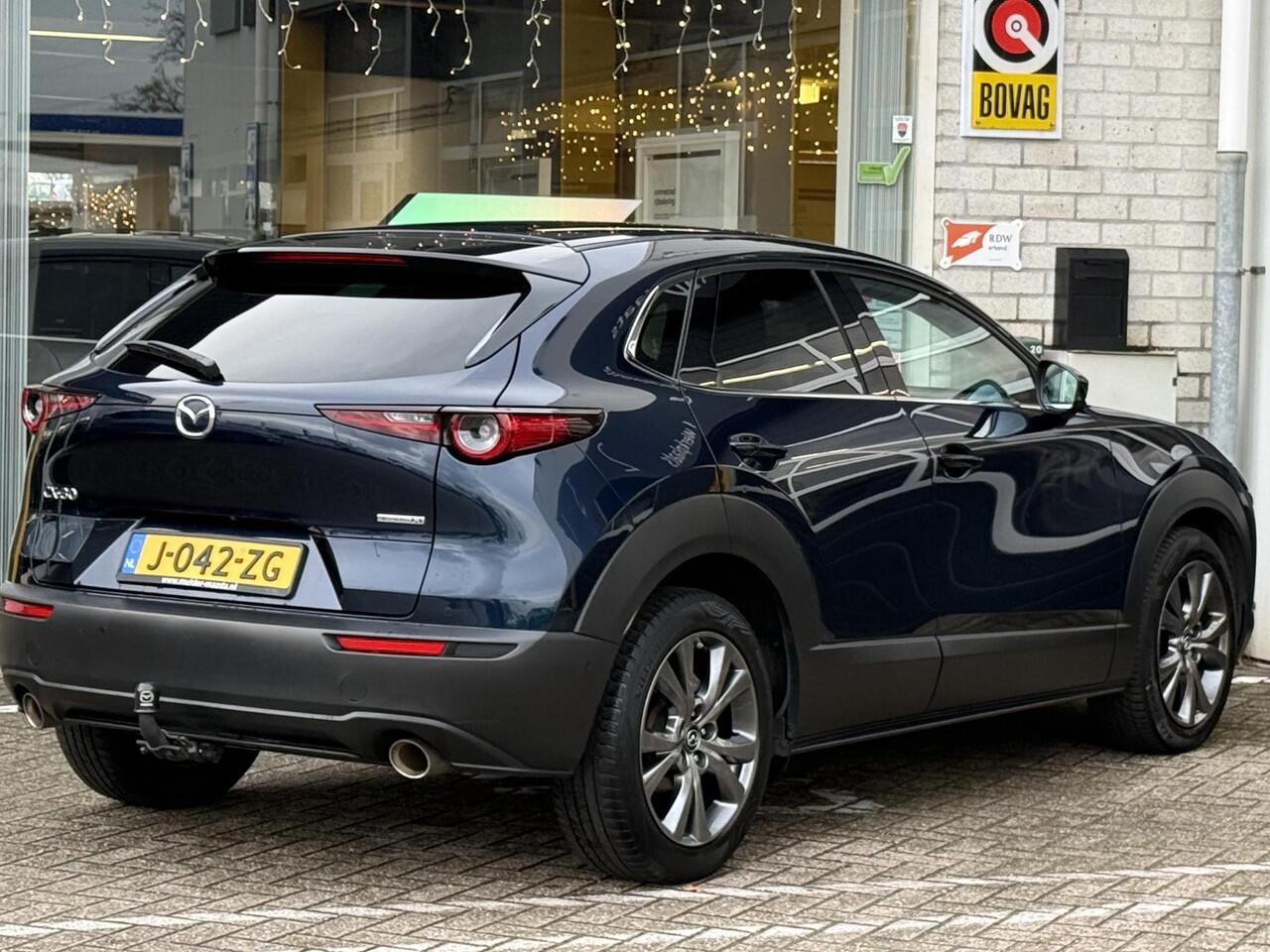 Mazda CX-30 2.0 e-SkyActiv-X M Hybrid Luxury | NAP | elektrisch glazen schuif-/kanteldak | Leer | Stoel & stuur verwarming | 360 graden camera | Bose Audio | Memory Stoelen |