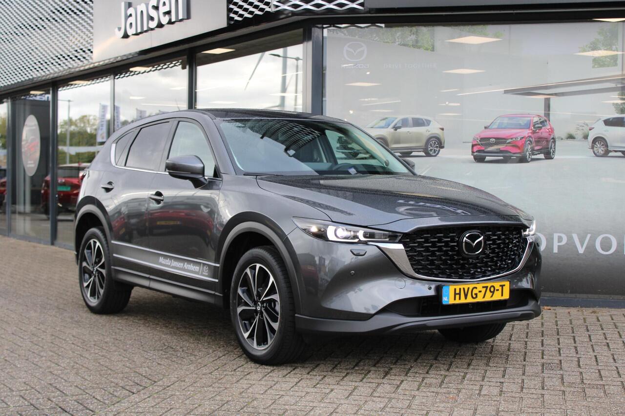 Mazda CX-5 2.0 e-SkyActiv-G M Hybrid 165 Exclusive-Line , Demovoordeel ¤ 5.000,-, Black Comfort Pack, Navi, Adap.Cruise, Clima, Leder, Apple Carplay, 360 Camera, PDC, HUD, Stoelverwarming/ventilatie, 19" LMV