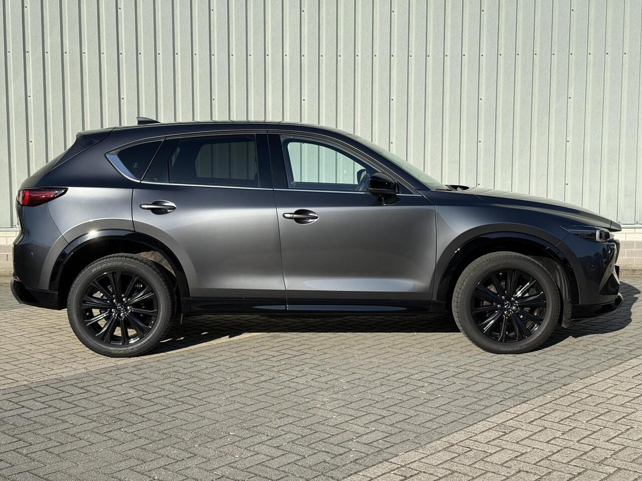 Mazda CX-5 2.0 e-SkyActiv-G M Hybrid 165 Homura / Fabrieksgarantie t/m 04-2027 / Comfort Pack / 19" LMV / 2.000 kg Trekgewicht / Lederen bekleding / Stoelventilatie voor / Verwarmde stoelen voor en achter / Adaptive Cruise / Rondomzicht Camera / Bose Audio /