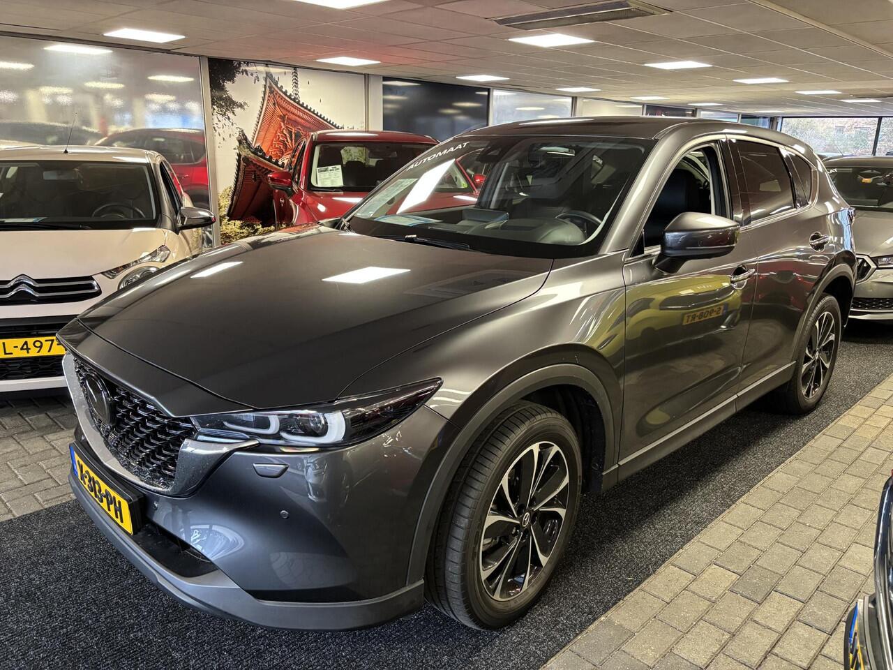 Mazda CX-5 2.0 e-SkyActiv-G M Hybrid 165 Exclusive-Line+Com.P , Automaat, Black Comfort Pack, Leder, Navi, Adap.Cruise, Clima, Apple Carplay, 360 Camera, PDC, HUD, Stuur/Stoelverwarming, 19" LMV