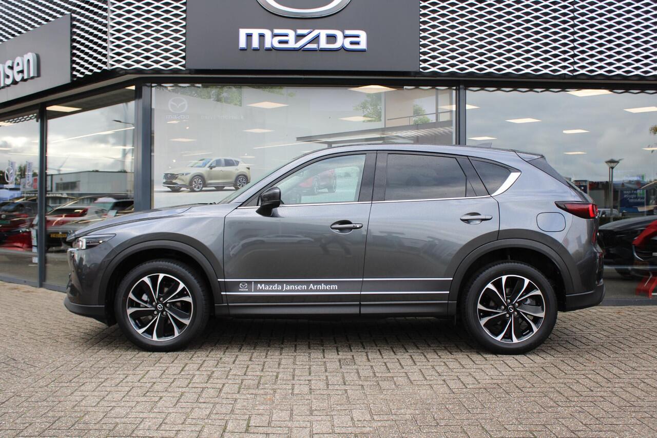 Mazda CX-5 2.0 e-SkyActiv-G M Hybrid 165 Exclusive-Line , Demovoordeel ¤ 7.100,-, Black Comfort Pack, Navi, Adap.Cruise, Clima, Leder, Apple Carplay, 360 Camera, PDC, HUD, Stoelverwarming/ventilatie, 19" LMV