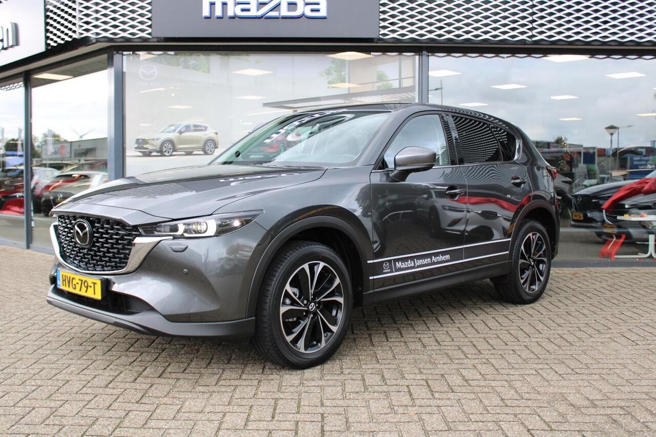Mazda CX-5 2.0 e-SkyActiv-G M Hybrid 165 Exclusive-Line , Demovoordeel ¤ 5.000,-, Black Comfort Pack, Navi, Adap.Cruise, Clima, Leder, Apple Carplay, 360 Camera, PDC, HUD, Stoelverwarming/ventilatie, 19" LMV