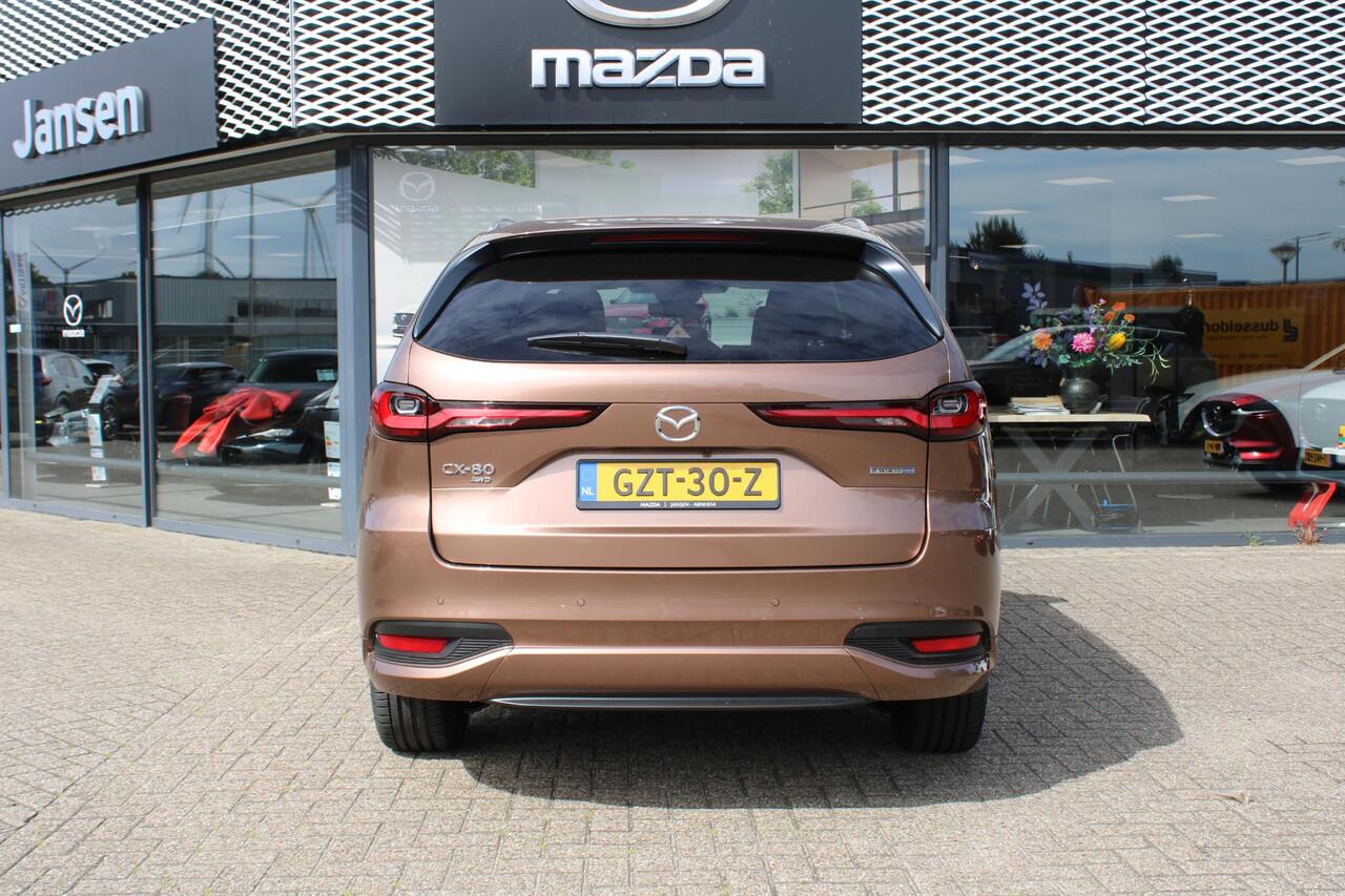 Mazda CX-80 2.5 e-SkyActiv PHEV Homura Plus , Demovoordeel ¤ 13.740,-, Automaat, Pano/Schuifdak, Klasse 3 Alarm, 7-Zits, Leder, 360 Camera, Bose, Adap Cruise, LMV 20 Inch