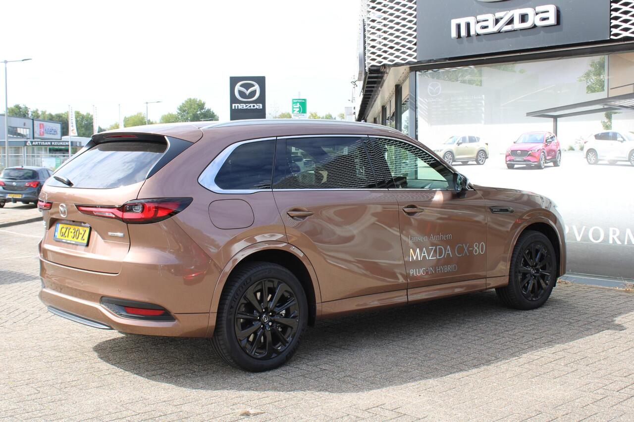 Mazda CX-80 2.5 e-SkyActiv PHEV Homura Plus , Demovoordeel ¤ 13.740,-, Automaat, Pano/Schuifdak, Klasse 3 Alarm, 7-Zits, Leder, 360 Camera, Bose, Adap Cruise, LMV 20 Inch