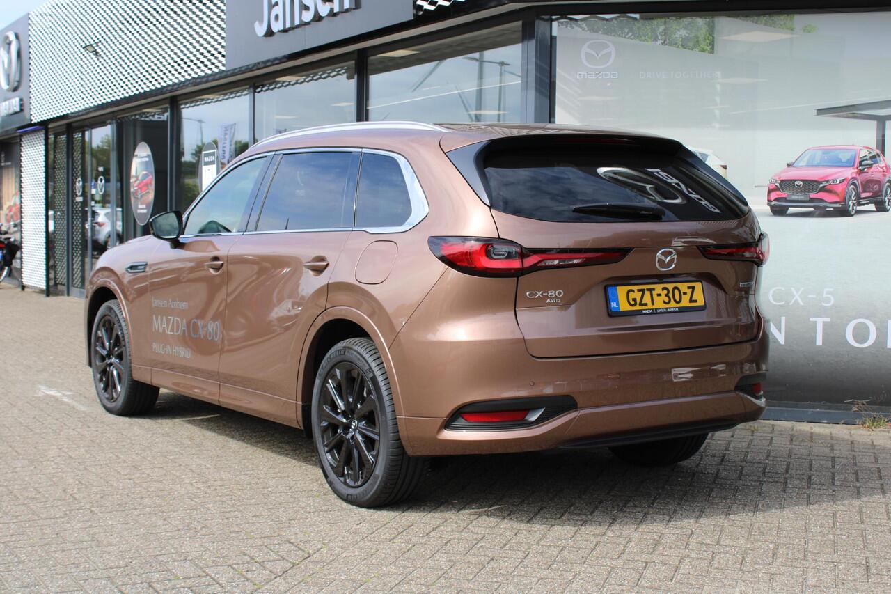 Mazda CX-80 2.5 e-SkyActiv PHEV Homura Plus , Demovoordeel ¤ 13.740,-, Automaat, Pano/Schuifdak, Klasse 3 Alarm, 7-Zits, Leder, 360 Camera, Bose, Adap Cruise, LMV 20 Inch