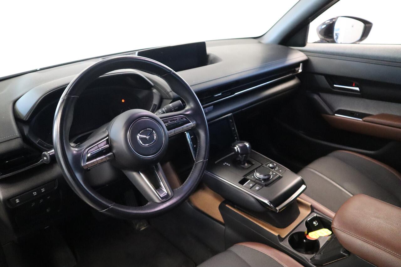 Mazda MX-30 e-SkyActiv 145 First Edition 36 kWh Navigatie Halfleder interieur 18 lmv lane ass. 24 maanden garantie mogelijk (*vraag naar de voorwaarden)