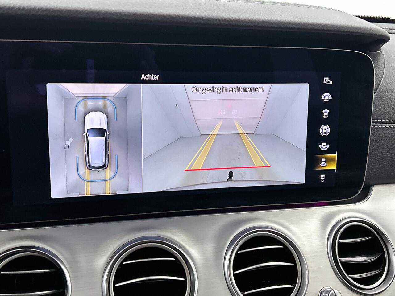 Mercedes-Benz E-estate 300 e Business Solution AMG | Panorama schuif/kanteldak | Trekhaak af fabriek wegklapbaar | Lederen bekleding | Alarm SCM3 | 360gr Camera | Inclusief 24 maanden Mercedes-Benz Certified garantie voor Europa.