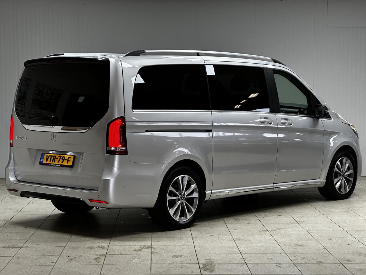 Mercedes-Benz EQV 300 L2 90kWh/ AMG Styling/ 2x Schuifdeur/ LED Koplampen/ 18'' LMV/ Vol Leder/ Elek. Kofferklep/ 360° Camera/ Sfeerverl./ Lane-Assist./ Apple + Android/ Elek. Stoelen + Memory/ Stoelverw.