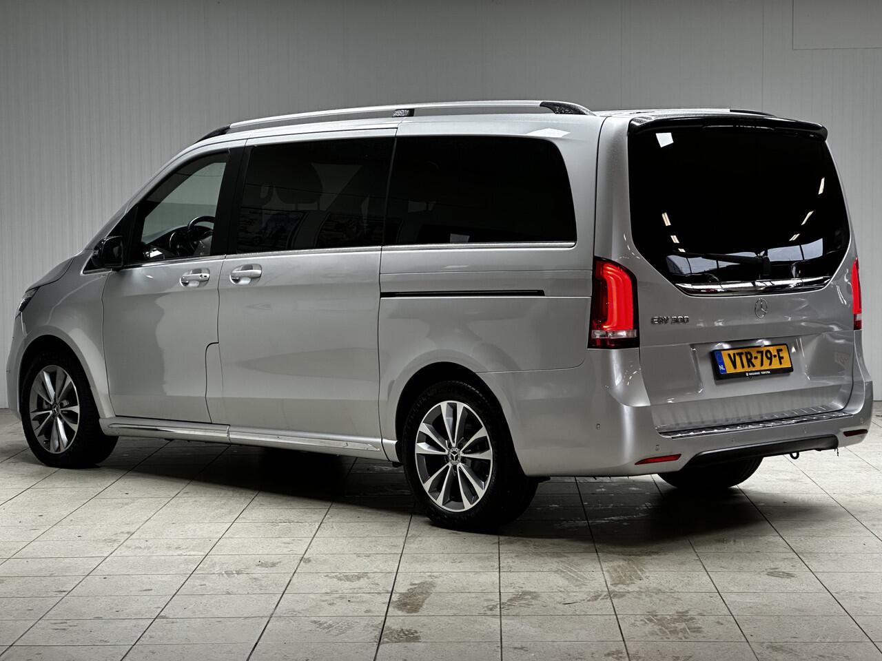 Mercedes-Benz EQV 300 L2 90kWh/ AMG Styling/ 2x Schuifdeur/ LED Koplampen/ 18'' LMV/ Vol Leder/ Elek. Kofferklep/ 360° Camera/ Sfeerverl./ Lane-Assist./ Apple + Android/ Elek. Stoelen + Memory/ Stoelverw.