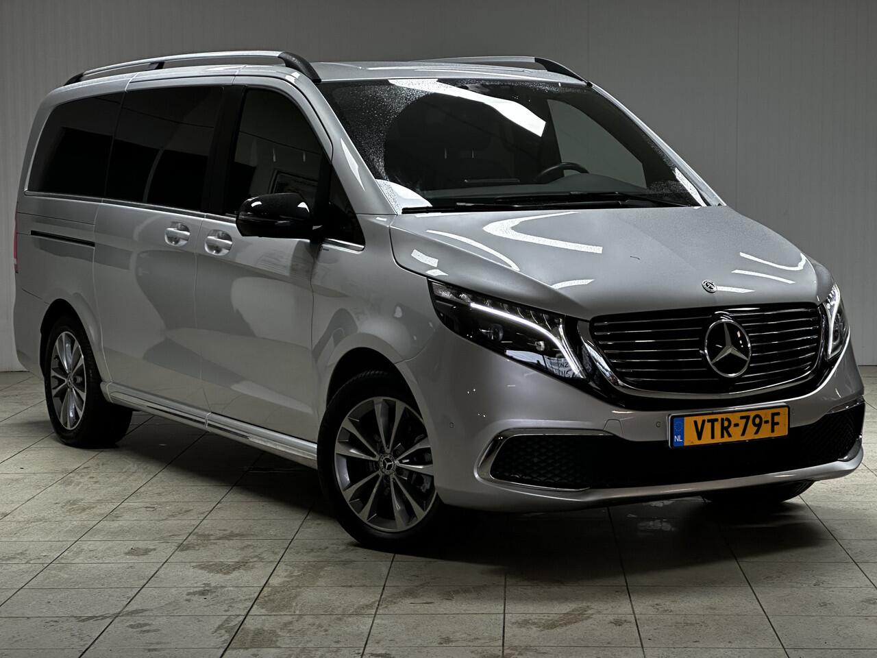 Mercedes-Benz EQV 300 L2 90kWh/ AMG Styling/ 2x Schuifdeur/ LED Koplampen/ 18'' LMV/ Vol Leder/ Elek. Kofferklep/ 360° Camera/ Sfeerverl./ Lane-Assist./ Apple + Android/ Elek. Stoelen + Memory/ Stoelverw.
